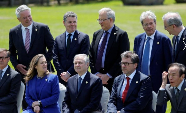 bank of japan governor kazuo ueda italy s economy minister giancarlo giorgetti bank of italy governor ignazio visco canada s minister of finance chrystia freeland bank of canada governor tiff macklem bank of france governor francois villeroy de galhau european commissioner for economy paolo gentiloni deputy governor of the bank of england jon cunliffe eurogroup president paschal donohoe and organisation for economic cooperation and development secretary general mathias cormann attend a family photo session at the g7 finance ministers and central bank governors meeting in niigata japan may 12 2023 reuters issei kato bank of japan governor kazuo ueda italy s economy minister giancarlo giorgetti bank of italy governor ignazio visco canada s minister of finance chrystia freeland bank of canada governor tiff macklem bank of france governor francois villeroy de galhau european commissioner for economy paolo gentiloni deputy governor of the bank of england jon cunliffe eurogroup president paschal donohoe and organisation for economic cooperation and development secretary general mathias cormann attend a family photo session at the g7 finance ministers and central bank governors meeting in niigata japan may 12 2023 reuters issei kato