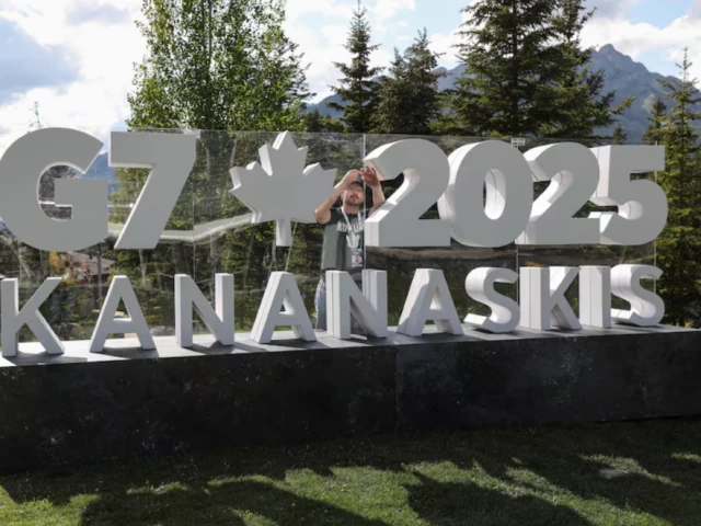 a worker prepares a sign ahead of the g7 summit at a satellite location in banff alberta canada june 14 2025 photo reuters a worker prepares a sign ahead of the g7 summit at a satellite location in banff alberta canada june 14 2025 photo reuters
