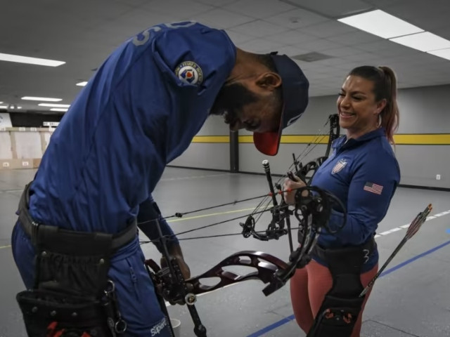 (Left) Gabriel George takes part in archery practice for the Invictus Games Team U.S. Training Camp at Fort Belvoir via WJXT