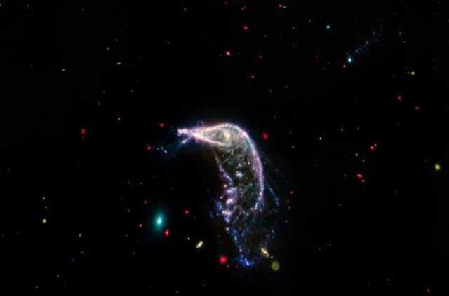 arp 142 two interacting galaxies are shown in an image obtained by the james webb space telescope using its mid infrared instrument miri instrument released by nasa on july 12 2014 at left is ngc 2937 an elliptical galaxy that looks like a tiny teal oval and is nicknamed the egg at right is ngc 2936 a distorted spiral galaxy nicknamed the penguin which is significantly larger photo reuters arp 142 two interacting galaxies are shown in an image obtained by the james webb space telescope using its mid infrared instrument miri instrument released by nasa on july 12 2014 at left is ngc 2937 an elliptical galaxy that looks like a tiny teal oval and is nicknamed the egg at right is ngc 2936 a distorted spiral galaxy nicknamed the penguin which is significantly larger photo reuters