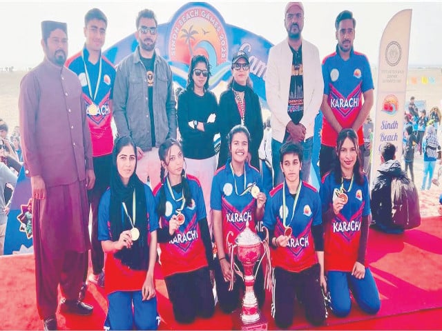 beaming members of team karachi flash their medals as they pose with the sindh beach games trophy at the concluding ceremony held at nishan e pakistan on seaview beach photo nni