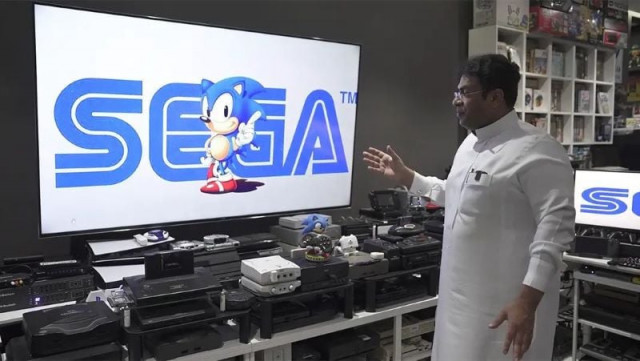 ibrahim al nasser with his gaming setup in which 444 video games consoles are connected to one single tv photo guinness world record website ibrahim al nasser with his gaming setup in which 444 video games consoles are connected to one single tv photo guinness world record website
