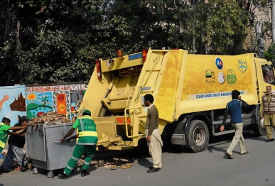 workers of lahore waste management company busy in removing the garbage as punjab government launched modern and organized system of cleanliness in the provincial capital city with the collaboration of turk companies photo app