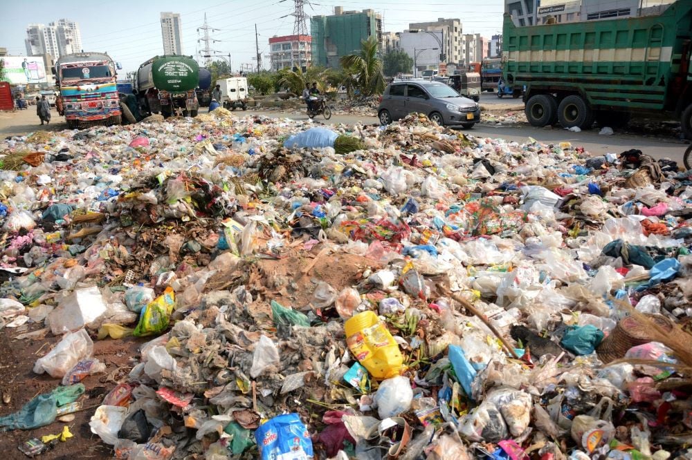 heap of garbage lying on the service road of korangi road shows the negligence of concerned authorities photo express