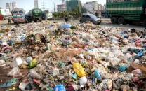 residents choke as sswmb turns open plot into dumping site in karachi residents choke as sswmb turns open plot into dumping site in karachi