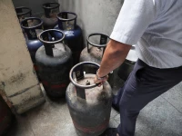 an employee checks empty lpg cylinders inside vidyarthi bhavan restaurant as restaurants and hotels in southern india including the it hub of bengaluru have warned of shutdowns amid disruptions in commercial lpg supply following the u s  israeli conflict with iran in bengaluru india march 10 2026 photo reuters