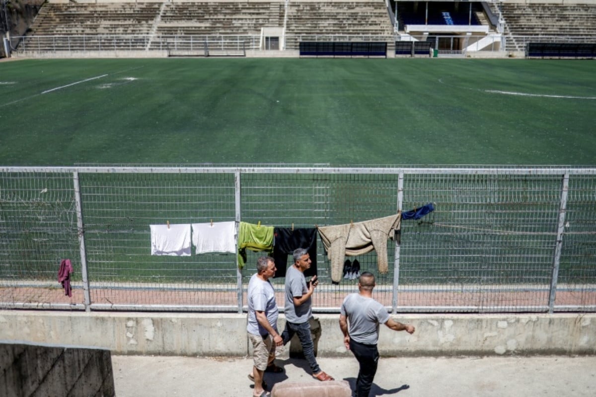 A dozen men from Gaza live in a former changing room under the bleachers of the stadium. PHOTO: AFP