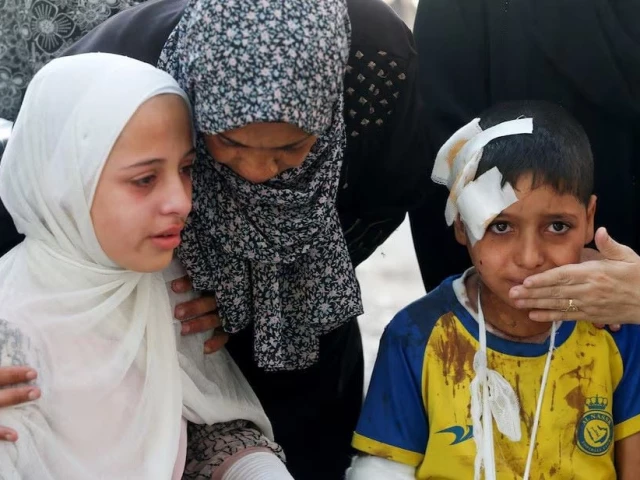 an injured boy and other mourners react during the funeral of palestinians who were killed by israeli fire while trying to receive aid in central gaza strip according to the gaza health ministry at al shifa hospital in gaza city june 24 2025 photo reuters an injured boy and other mourners react during the funeral of palestinians who were killed by israeli fire while trying to receive aid in central gaza strip according to the gaza health ministry at al shifa hospital in gaza city june 24 2025 photo reuters