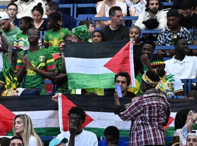 football fans protest israel with palestinian flags at olympics