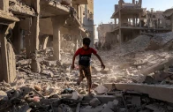 a boy walks through the rubble of a building that was destroyed following israeli bombardment at the maghazi refugee camp in the central gaza strip on 12 june 2026 photo afp