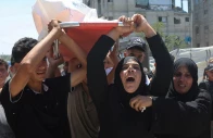 mother of palestinian child muataz abu shaar who was killed by israeli fire according to medics and other mourners carry his body during his funeral in khan younis in the southern gaza strip july 14 2026 photo reuters