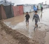 two boys walk through a waterlogged alley at a makeshift camp housing displaced palestinians in deir al balah gaza photo afp two boys walk through a waterlogged alley at a makeshift camp housing displaced palestinians in deir al balah gaza photo afp