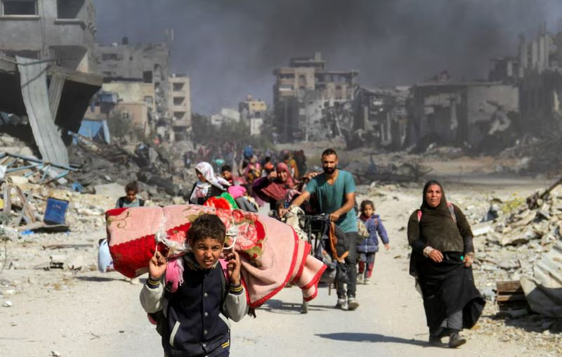 displaced palestinians make their way after fleeing the northern part of gaza amid an israeli military operation in gaza city november 5 2024 photo reuters