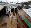 a displaced palestinian man clears muddy water in a flooded tent camp on a rainy day in nuseirat central gaza strip december 12 2025 photo reuters a displaced palestinian man clears muddy water in a flooded tent camp on a rainy day in nuseirat central gaza strip december 12 2025 photo reuters