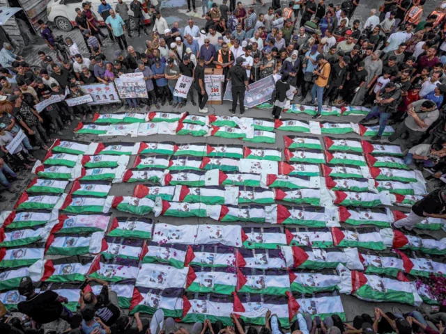 mass funeral mourners gather for the burial of around 100 palestinians including 62 children whose remains were recovered from rubble in gaza city photo afp mass funeral mourners gather for the burial of around 100 palestinians including 62 children whose remains were recovered from rubble in gaza city photo afp