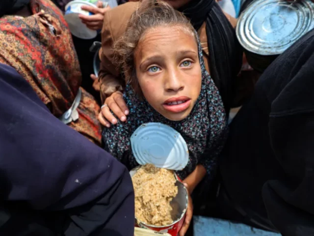 a palestinian girl holds a container at a food distribution point in the nuseirat camp for refugees in the central gaza strip on may 21 2025 photo afp a palestinian girl holds a container at a food distribution point in the nuseirat camp for refugees in the central gaza strip on may 21 2025 photo afp