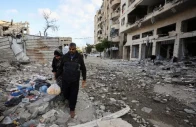 palestinians walk at the site of an israeli airstrike on a residential building on friday in gaza city on may 16 2026 photo reuters