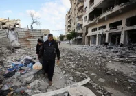 palestinians walk at the site of an israeli airstrike on a residential building on friday in gaza city on may 16 2026 photo reuters