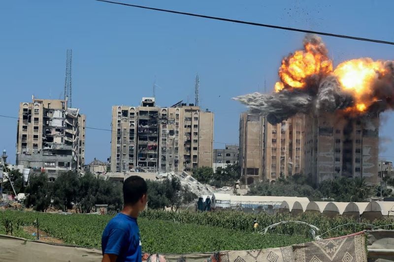 an explosion occurs following an israeli air strike on a residential building amid the israel hamas conflict in nuseirat in the central gaza strip july 20 2024 photo reuters