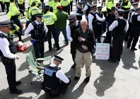 police officers detain a protester at everyone day a mass vigil and sign holding event in trafalgar square organised by defend our juries to demand the lifting of the ban on palestine action in london britain april 11 2026 photo reuters