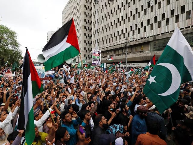 people carry flags as they chant slogans to express solidarity with palestinian people and to protest against israel during a rally in karachi pakistan may 21 2021 photo reuters