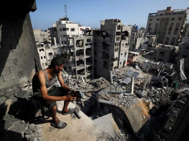 a palestinian looks on at the site of thursday s israeli strike that damaged and destroyed residential buildings at shati beach refugee camp in gaza city july 4 2025 photo reuters a palestinian looks on at the site of thursday s israeli strike that damaged and destroyed residential buildings at shati beach refugee camp in gaza city july 4 2025 photo reuters