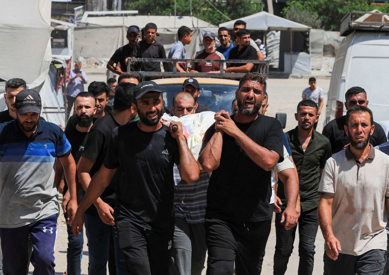 People carry the body of a Palestinian who was killed in Israeli strikes, according to medics, during a funeral in Gaza City, September 1, 2026. REUTERS
