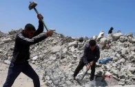 palestinian workers break up concrete while working on rubble in khan younis southern gaza strip april 19 2026 photo reuters