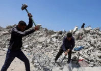 palestinian workers break up concrete while working on rubble in khan younis southern gaza strip april 19 2026 photo reuters