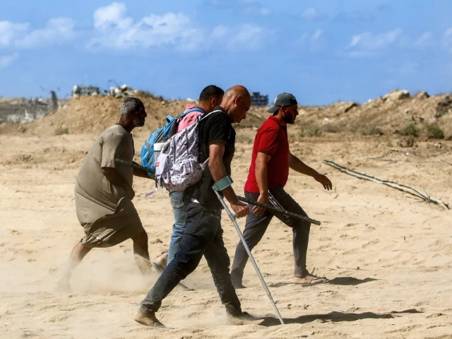 a man walks with crutches with others along the road to gaza city near nuseirat in the central gaza strip on october 10 2025 gaza s civil defence agency said on october 10 that israeli forces have begun pulling back from parts of the territory particularly in gaza city and khan yunis israeli prime minister s office said that the government had approved the framework of a hostage release deal with hamas as both sides edged closer to ending more than two years of hostilities in gaza photo afp a man walks with crutches with others along the road to gaza city near nuseirat in the central gaza strip on october 10 2025 gaza s civil defence agency said on october 10 that israeli forces have begun pulling back from parts of the territory particularly in gaza city and khan yunis israeli prime minister s office said that the government had approved the framework of a hostage release deal with hamas as both sides edged closer to ending more than two years of hostilities in gaza photo afp