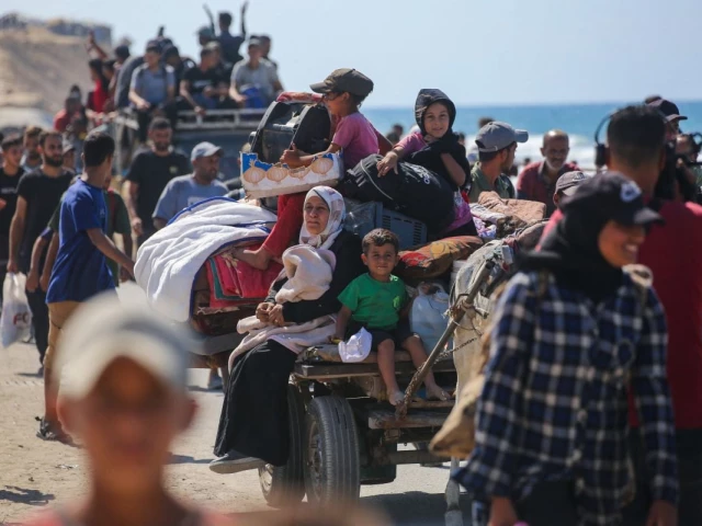 palestinians make their way along al rashid road toward gaza city from nuseirat in the central gaza strip on october 10 2025 photo afp palestinians make their way along al rashid road toward gaza city from nuseirat in the central gaza strip on october 10 2025 photo afp