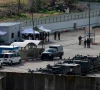 israeli troops gather with their vehicles inside the ofer military prison complex located between ramallah and beitunia in the occupied west bank before releasing palestinian prisoners as part of a hostage prisoner exchange on february 8 2025 photo afp