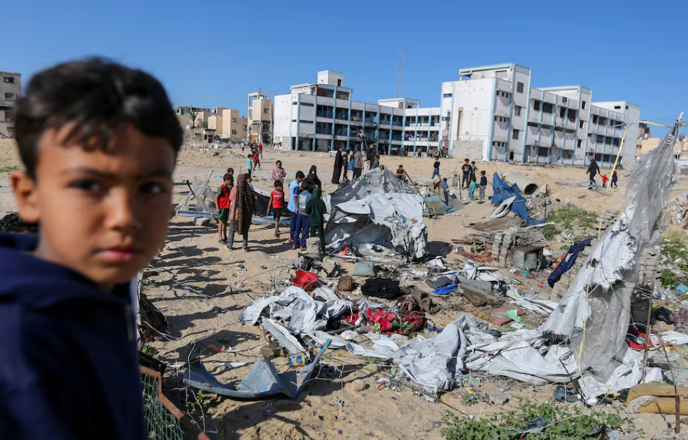 palestinians inspect the site of an israeli strike on a tent housing displaced people in khan younis in the southern gaza strip march 19 photo reuters