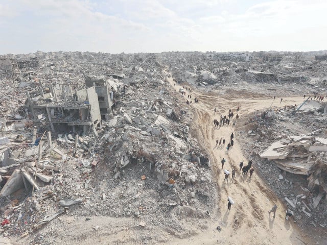 gazans head destroyed homes