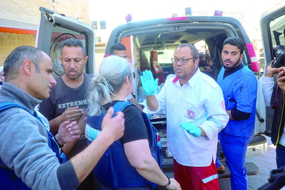 hospital staff transport the body of a foreign un worker in an ambulance in gaza photo afp