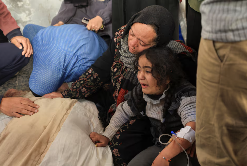 mourners react next to the bodies of palestinians killed in israeli strikes at al ahli arab baptist hospital in gaza city march 24 2025 photo reuters