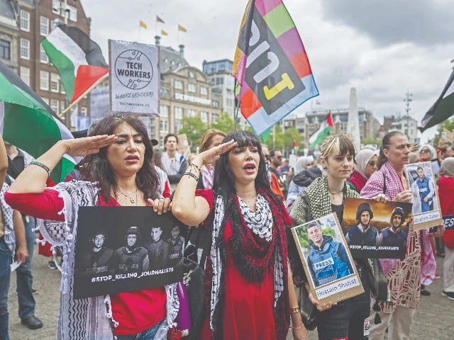 protestors hold portraits of journalists killed in gaza during a pro palestinian demonstration in amsterdam photo afp