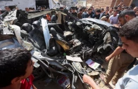 palestinians inspect the site of an israeli strike on a car in khan younis in the southern gaza strip may 10 2026 reuters