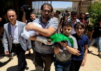 father and brother of sam abu haykal a 7 month old palestinian child who was killed by israeli soldiers carry his body during his funeral in hebron in the israeli occupied west bank june 6 2026 reuters