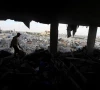 a palestinian man inspects the site of an israeli strike on a house whose residents were warned to evacuate before the attack near a tent camp sheltering displaced people that was damaged in the strike in khan younis in the southern gaza strip june 7 2026 reuters