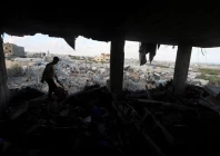a palestinian man inspects the site of an israeli strike on a house whose residents were warned to evacuate before the attack near a tent camp sheltering displaced people that was damaged in the strike in khan younis in the southern gaza strip june 7 2026 reuters