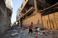 a palestinian boy runs past the site of an israeli strike on an apartment in gaza city june 20 2026 reuters