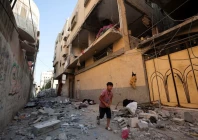 a palestinian boy runs past the site of an israeli strike on an apartment in gaza city june 20 2026 reuters