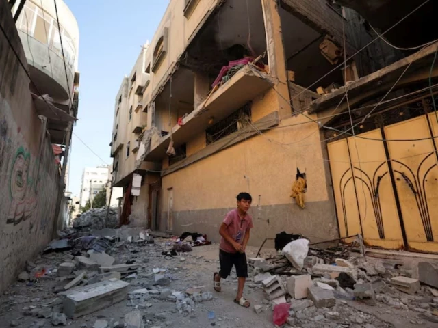 a palestinian boy runs past the site of an israeli strike on an apartment in gaza city june 20 2026 reuters a palestinian boy runs past the site of an israeli strike on an apartment in gaza city june 20 2026 reuters