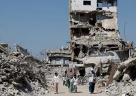 palestinians walk past the rubble of residential buildings destroyed during the war at jabalia refugee camp in the northern gaza strip august 5 2026 reuters