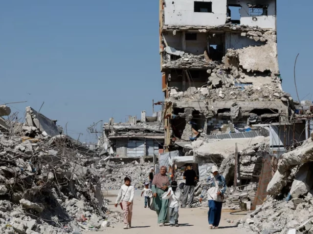 palestinians walk past the rubble of residential buildings destroyed during the war at jabalia refugee camp in the northern gaza strip august 5 2026 reuters palestinians walk past the rubble of residential buildings destroyed during the war at jabalia refugee camp in the northern gaza strip august 5 2026 reuters