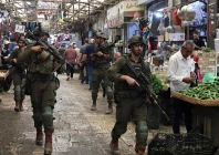 this photo taken on august 9 2026 shows armed israeli soldiers carrying out a foot patrol through the market in the old city of nablus in the northern israeli occupied west bank photo afp