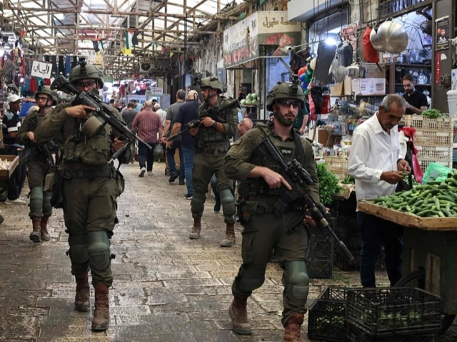 this photo taken on august 9 2026 shows armed israeli soldiers carrying out a foot patrol through the market in the old city of nablus in the northern israeli occupied west bank photo afp this photo taken on august 9 2026 shows armed israeli soldiers carrying out a foot patrol through the market in the old city of nablus in the northern israeli occupied west bank photo afp