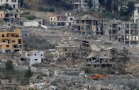 damaged and destroyed buildings are seen as israeli heavy machinery bulldozes houses in mansouri viewed from hinniyeh southern lebanon photo reuters