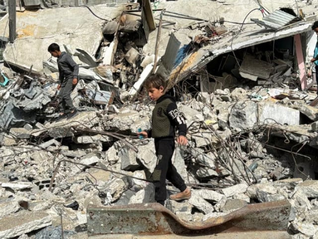 a palestinian boy walks on the site of an israeli strike amid the ongoing conflict between israel and the palestinian islamist group hamas in rafah in the southern gaza strip march 27 2024 photo reuters a palestinian boy walks on the site of an israeli strike amid the ongoing conflict between israel and the palestinian islamist group hamas in rafah in the southern gaza strip march 27 2024 photo reuters
